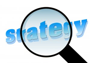Magnifying glass over strategy
